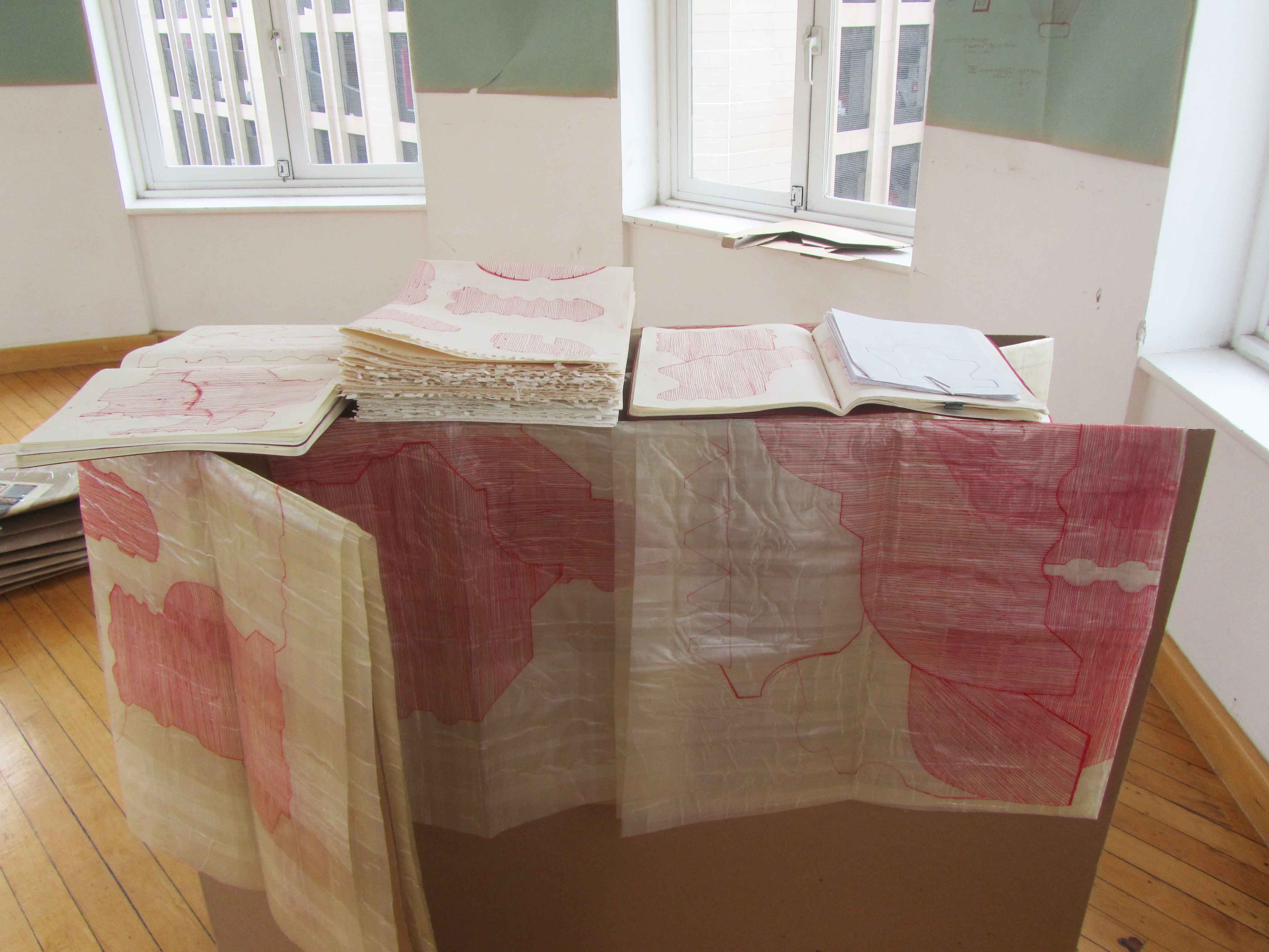 RAUMARCHIV 01 (space archive), folded drawings and books, installation on cardboard 